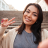 beautiful-smiling-asian-woman-showing-peace-gesture-while-taking-selfie-mobile-phone-city-stairs